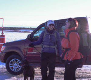 Ladies going for hike with dog at Chena Lake Recreation area - flood control.
